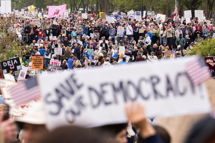 Protesters gather on the National Mall for the nationwide "Hands Off!" protest against US President Donald Trump and his advisor, Tesla CEO Elon Musk, in Washington, DC, on April 5, 2025. (Photo by ROBERTO SCHMIDT/AFP via Getty Images)