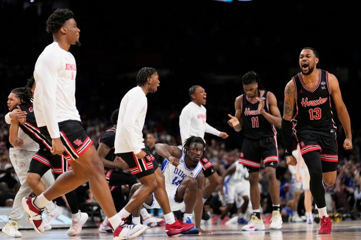 Houston forward J'Wan Roberts, right, celebrates after their win against the Duke in the national semifinals at the Final Four of the NCAA college basketball tournament, Saturday, April 5, 2025, in San Antonio. (AP Photo/Brynn Anderson)