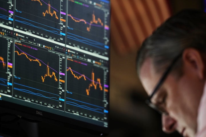 An electronic display shows financial information on the floor at the New York Stock Exchange in New York, Monday, April 7, 2025. (AP Photo/Seth Wenig)