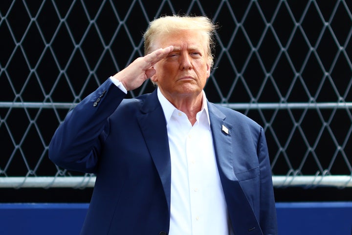 President Donald Trump salutes during the national anthem ahead of the F1 Grand Prix of Miami in 2024.