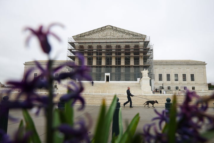 WASHINGTON, DC - APRIL 07: A member of the Capitol Police K-9 unit walks a dog in front of the U.S. Supreme Court is on April 07, 2025 in Washington, DC. On Monday, the Trump administration requested that the Supreme Court block a lower court's order stating that officials must return a man mistakenly deported to El Salvador to Maryland. (Photo by Kayla Bartkowski/Getty Images)