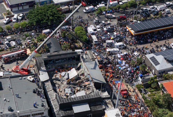 Rescue workers search for survivors at the Jet Set nightclub after its roof collapsed during a merengue concert in Santo Domingo, Dominican Republic, Tuesday, April 8, 2025.