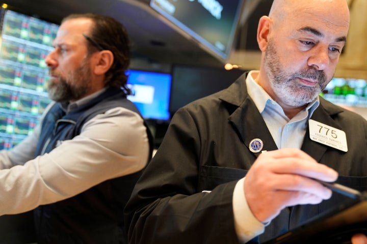 Federico DeMarco works on the floor at the New York Stock Exchange in New York, Tuesday, April 8, 2025. (AP Photo/Seth Wenig)
