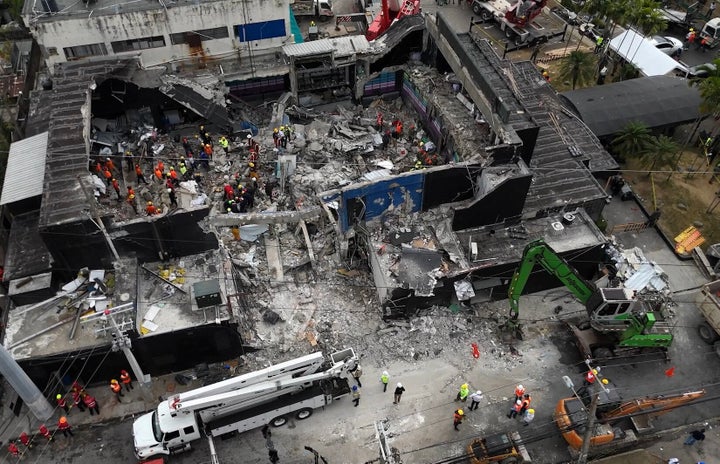 This aerial view shows rescue teams working at the Jet Set nightclub a day after the collapse of its roof in Santo Domingo on April 9, 2025. (Photo by ALFRED DAVIES/AFP via Getty Images)