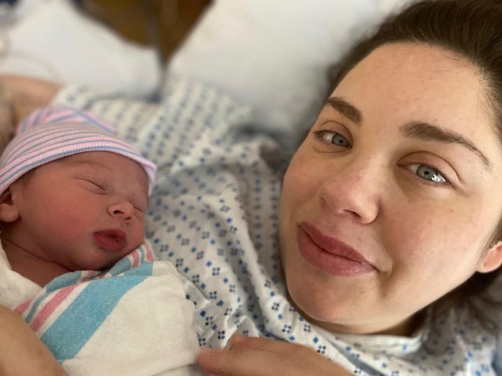 The author welcoming her eldest daughter into the world, in the early days of her "momification" journey.