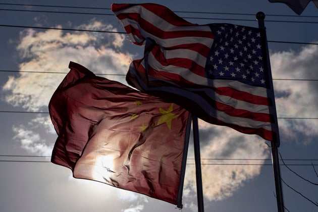 Chinese and United States flags are flown outside the China International Supply Chain Expo in Beijing, Nov. 27, 2024. (AP Photo/Ng Han Guan)