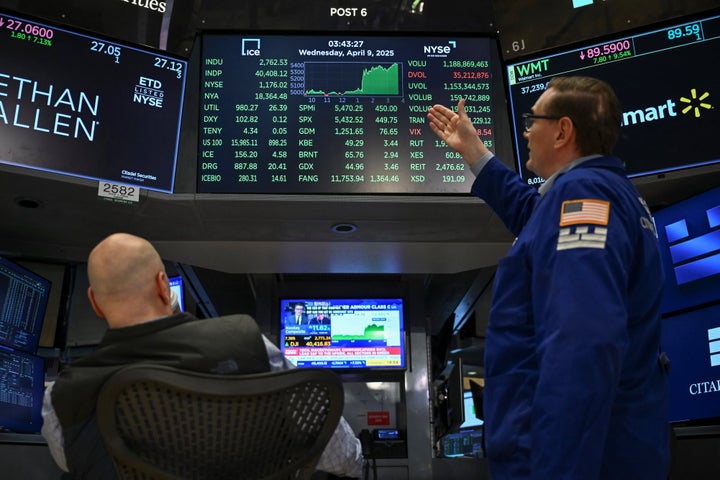 Traders work on the floor of the New York Stock Exchange (NYSE) during afternoon trading on April 9, 2025 in New York. Wall Street stocks rocketed to close solidly higher Wednesday, with dramatic advances on all three major indexes as US President Donald Trump delayed steep new tariffs hours after they took effect. The Dow Jones Industrial Average surged 7.9 percent to 40,608.45, the broad-based S&P 500 Index rallied 9.5 percent to 5,456.90, and the tech-focused Nasdaq Composite Index jumped more than 12.2 percent to 17,124.97. (Photo by ANGELA WEISS / AFP) (Photo by ANGELA WEISS/AFP via Getty Images) 