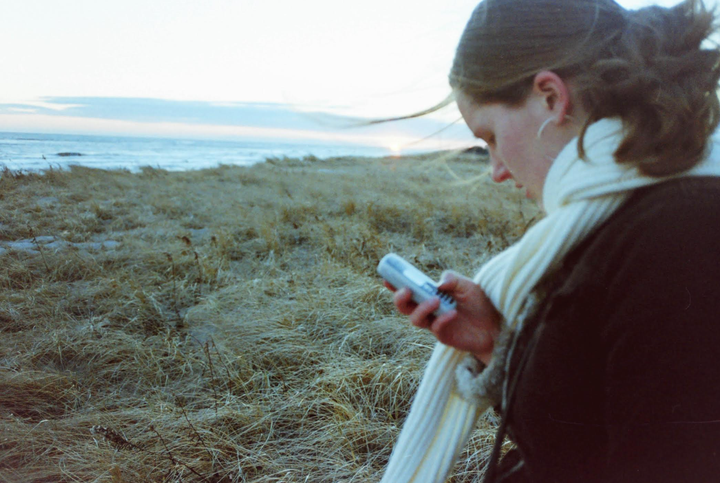 The author with her first color cell phone (2003).