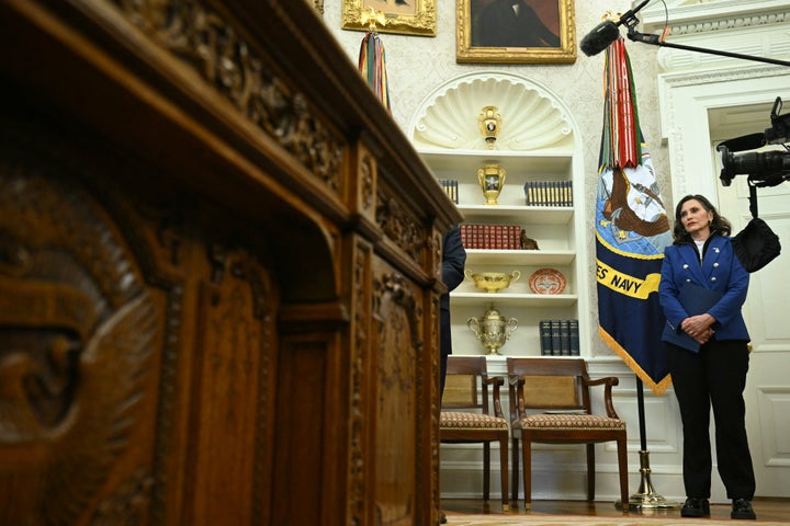 Michigan Governor Gretchen Whitmer looks on as President Donald Trump signs an executive order in the Oval Office of the White House on April 9, 2025.
