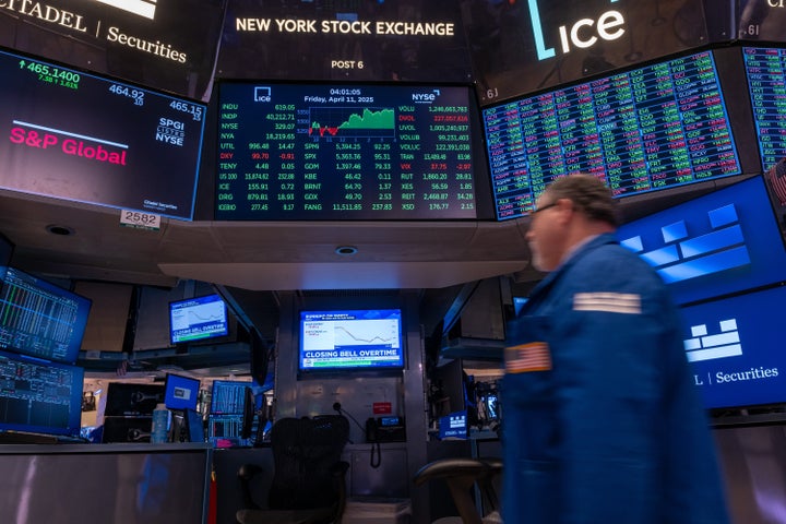 Traders work on the floor of the New York Stock Exchange on April 11.