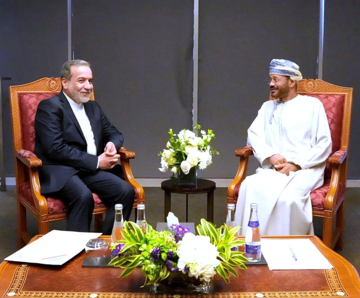In this photo released by Iranian Foreign Ministry, Iranian Foreign Minister Abbas Araghchi, left, meets his Omani counterpart Sayyid Badr Albusaidi prior to negotiations with U.S. Mideast envoy Steve Witkoff in Muscat, Oman, Saturday, April 12, 2025. (Iranian Foreign Ministry via AP)