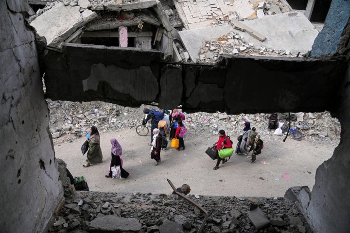 Displaced Palestinians flee from east to west of Gaza City after the Israeli military issued evacuation orders in the area, Friday April 11, 2025. (AP Photo/Jehad Alshrafi)