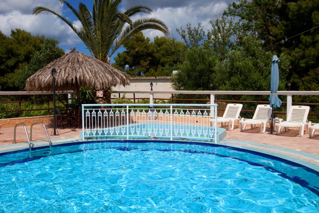 Swimming pool at holiday villa in Greece. Holiday and travel concept.
