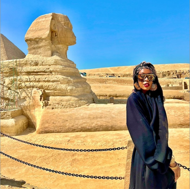 "I just wanted to do something to impact people the way travel has impacted me," writes author Imani Bashir, pictured here during a trip to Egypt.