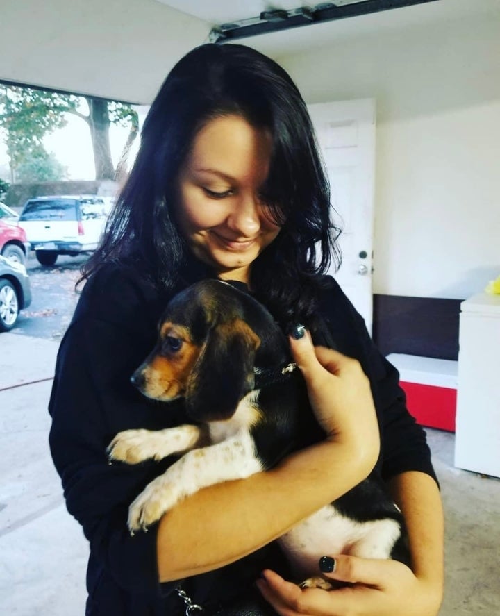 The author and Biscuit, when she was a puppy.