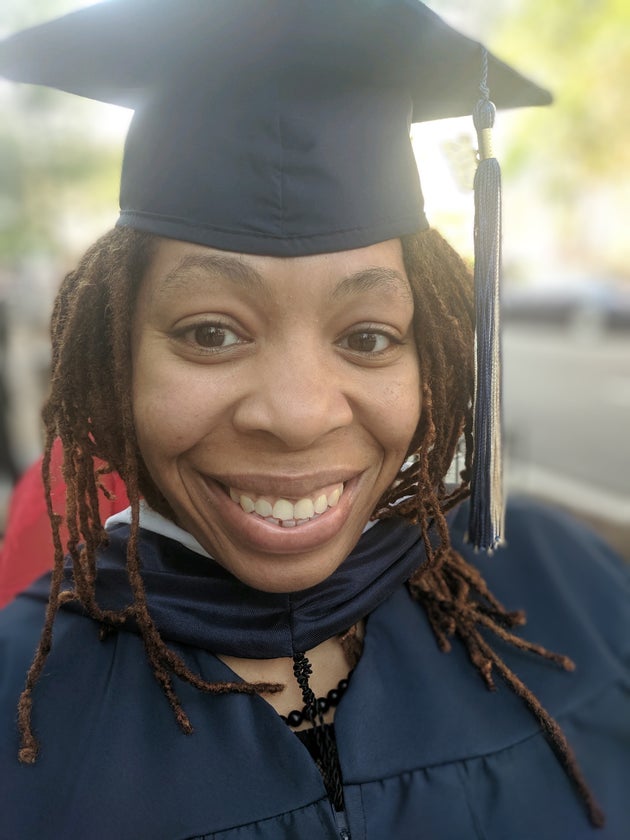 The author celebrates graduating from George Washington University with a Master of Professional Studies in Publishing.