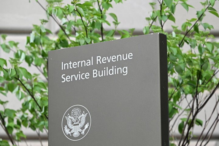 Signage for the Internal Revenue Service (IRS) is seen outside IRS headquarters in Washington, DC, on April 15, 2025. The US federal tax agency has reached an agreement to share highly regulated taxpayer information with immigration authorities -- a move that could help them identify immigrants they want to deport, court filings showed on April 8, 2025. The deal is a victory for the Trump administration, which has launched a massive deportation push, but has caused an outcry by immigrant rights groups. The Internal Revenue Service (IRS) allows millions of undocumented migrants to pay taxes, a move seen as boosting both their immigration cases and the financial health of massive US federal programs such as Social Security. (Photo by Jim WATSON / AFP) (Photo by JIM WATSON/AFP via Getty Images)