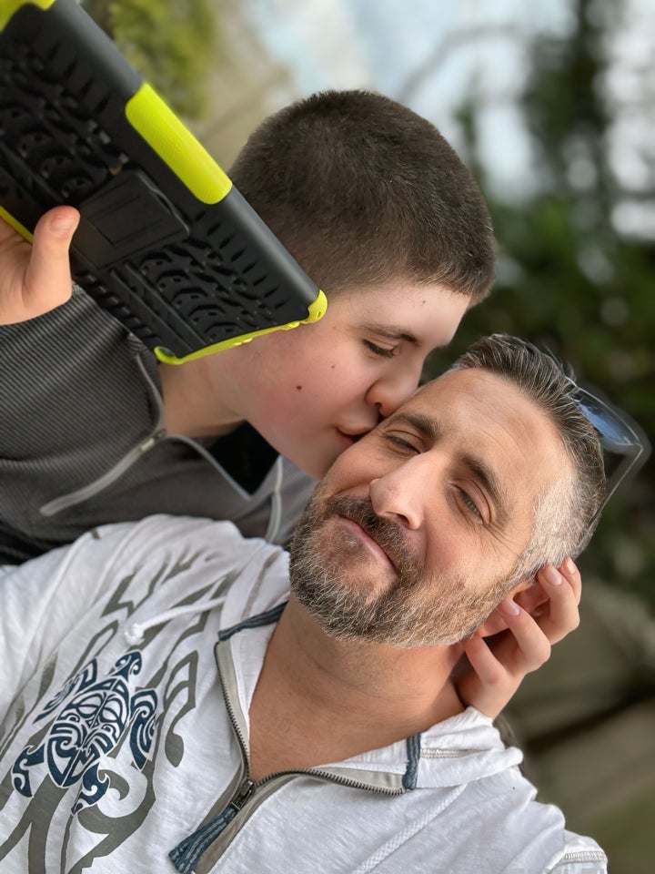 Lucas kissing the author on the cheek.