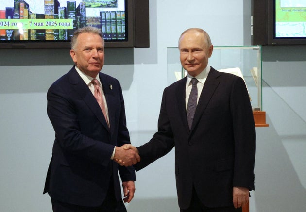 In this pool photograph distributed by the Russian state agency Sputnik, Russian President Vladimir Putin shakes hands with U.S. President Donald Trump's envoy Steve Witkoff during a meeting in Saint Petersburg on April 11.