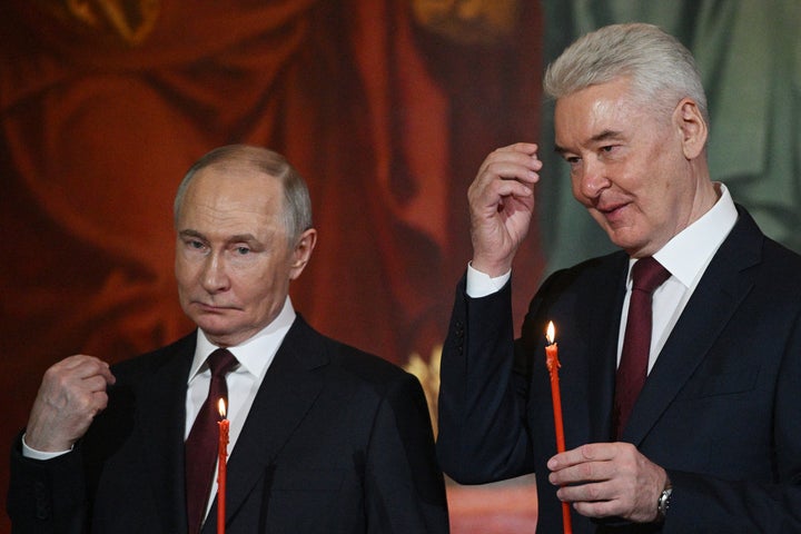 Russian President Vladimir Putin, left, and Moscow Mayor Sergei Sobyanin attend the Orthodox Easter service at Christ the Saviour Cathedral in Moscow, Russia, Saturday, April 19, 2025. (Ramil Sitdikov/Sputnik/Kremlin Pool Photo via AP)