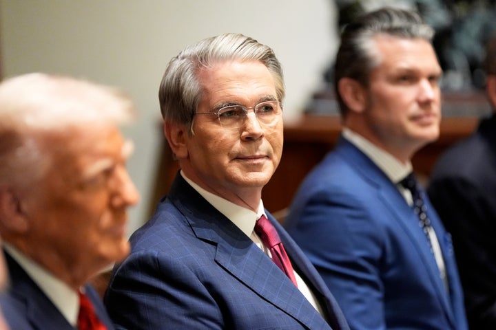 Treasury Secretary Scott Bessent and Defense Secretary Pete Hegseth listen as President Donald Trump speaks before a luncheon with Italy's Prime Minister Giorgia Meloni in the Cabinet Room of the White House, Thursday, April 17, 2025, in Washington. (AP Photo/Alex Brandon)