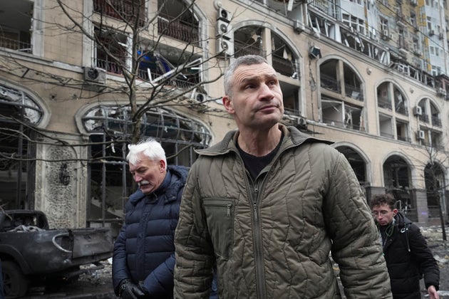 Mayor of Kyiv Vitali Klitschko inspects damage around a residential building hit by a Russian rocket attack.