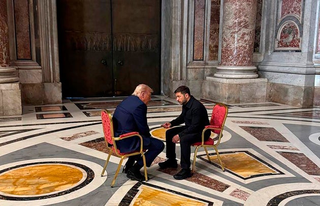 Volodymyr Zelenskyy and Donald Trump, talk as they attend the funeral of Pope Francis in the Vatican, Saturday.