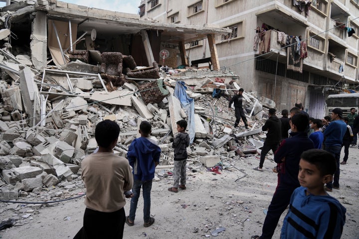 Palestinians inspect the damage after an Israeli army airstrike in Gaza City, on Saturday, April 26, 2025. (AP Photo/Jehad Alshrafi)