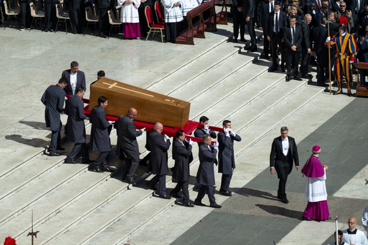 Pallbearers carry the coffin of Pope Francis across St. Peter's Square in Vatican City on April 26, 2025. The funeral Mass for Pope Francis brings together cardinals, bishops, and faithful from around the world in a final tribute to his papacy. (Photo by Bob Reijnders / Middle East Images / Middle East Images via AFP) (Photo by BOB REIJNDERS/Middle East Images/AFP via Getty Images)