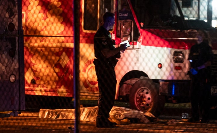 9 Killed As Car Plows Into Filipino Road Competition Crowd In Vancouver 2 A victim lies near a food truck after a car drove into a crowd at the Lapu Lapu Festival in Vancouver on Saturday April 26, 2025. (Rich Lam/The Canadian Press via AP)