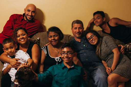 The author's grandson Jovani, daughter Cristina, son-in-law Sandro, Maggie, grandson Justin, the author, daughter Daniela, grandson Anthony, and A.J. the dog in Miami, Florida, in December 2014.