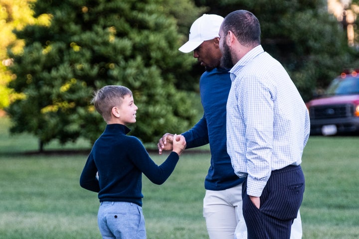 Barkley and Theodore Kushner shake hands on the South Lawn of the White House.