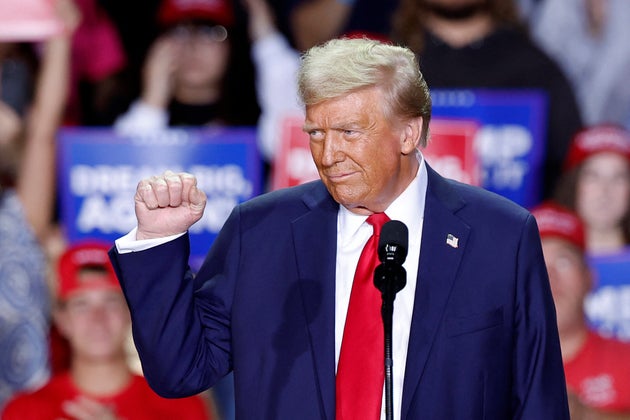 Former US President and Republican presidential candidate Donald Trump gestures as he speaks during a campaign rally at Van Andel Arena in Grand Rapids, Michigan on November 5, 2024.