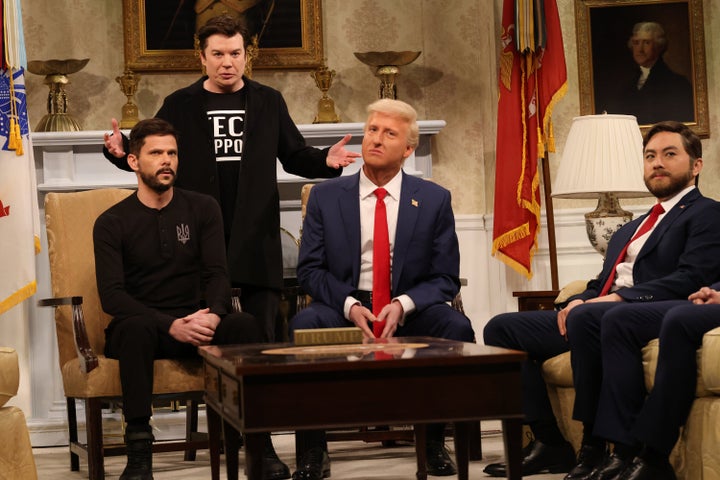 A March "Saturday Night Live" sketch in which Mike Myers plays Elon Musk, alongside, from left, Mikey Day as Ukrainian President Volodymyr Zelenskyy; James Austin Johnson as Donald Trump; and Bowen Yang as JD Vance.