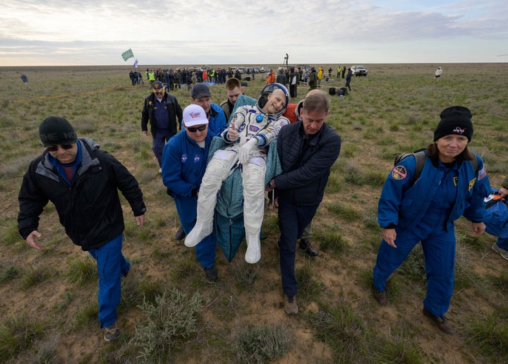 This image provided by NASA shows astronaut Don Pettit being carried to a medical tent shortly after he, and Roscosmos cosmonauts Alexey Ovchinin and Ivan Vagner landed in their Soyuz MS-26 spacecraft near the town of Zhezkazgan, Kazakhstan on Sunday, April 20, 2025.