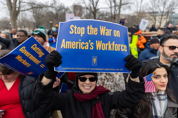 Members of the American Federation of Government Employees (AFGE) union protest against firings during a rally to defend federal workers in Washington, D.C., on Feb. 11.