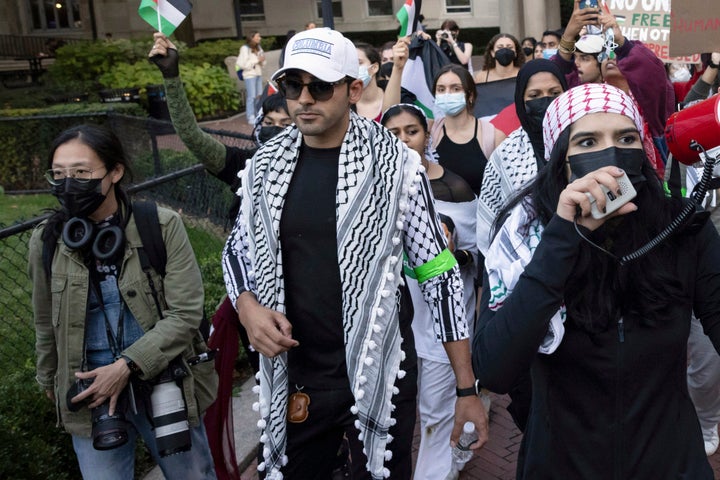 Mohsen Mahdawi, center, looks on during a pro-Palestinian protest at Columbia University, Thursday, Oct. 12, 2023, in New York. (AP Photo/Yuki Iwamura, File)