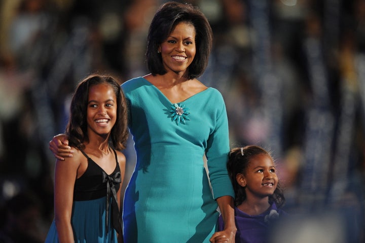 Michelle Obama brings daughters Malia, left, and Sasha on stage at the Democratic National Convention in 2008 at the Pepsi Center in Denver.