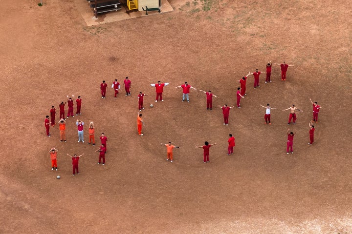 A drone view of detainees forming the letters SOS with their bodies in the courtyard at the Bluebonnet Detention Facility, where Venezuelans at the center of a U.S. Supreme Court ruling are held, in Anson, Texas, on April 28, 2025.