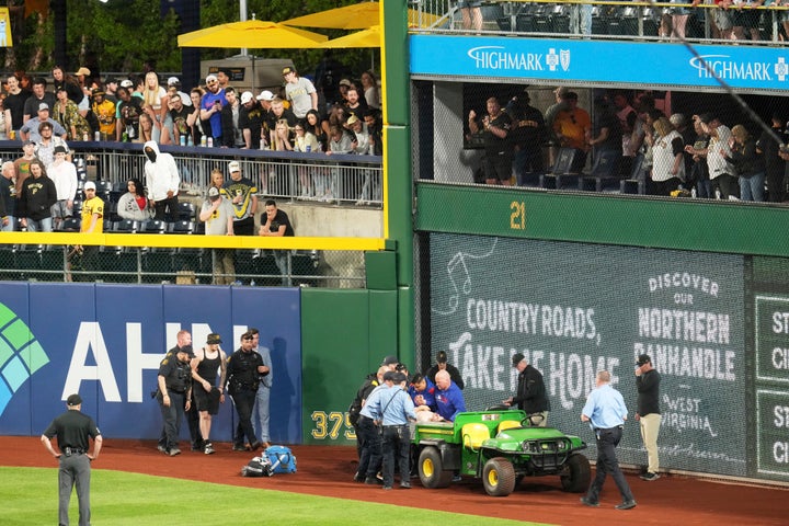 A fan is carted of the field at PNC Park after falling out of the stands.