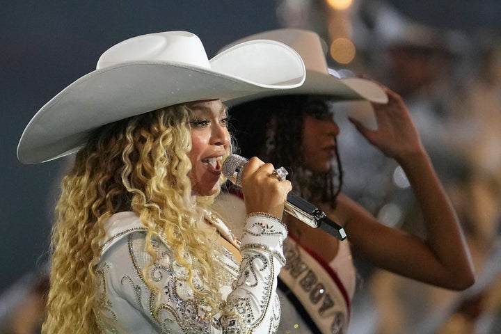 Beyoncé, left, performs with her daughter Blue Ivy Carter during halftime of an NFL football game between the Baltimore Ravens and Houston Texans Wednesday, Dec. 25, 2024, in Houston.