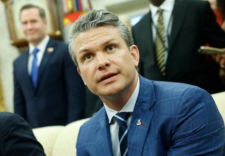 Defense Secretary Pete Hegseth answers a reporter's question during a meeting April 7.