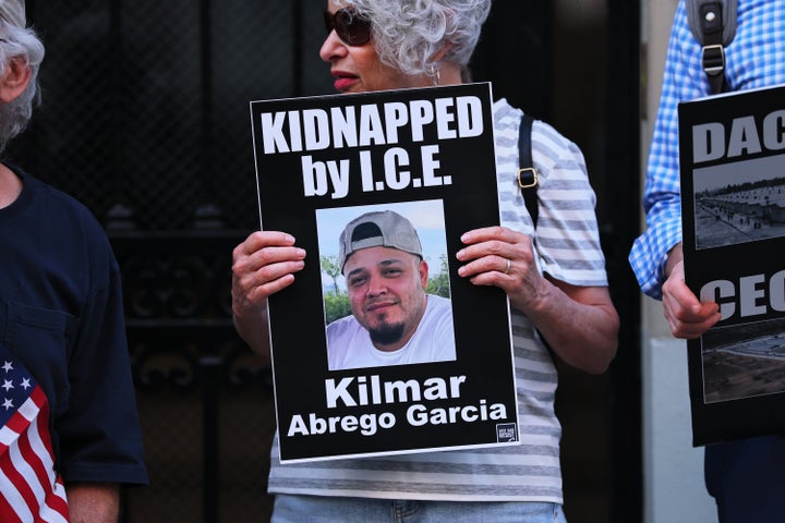 A protester holds a photo of Maryland man Kilmar Abrego Garcia as demonstrators gather to protest against the deportation of immigrants to El Salvador outside on April 24 in New York City.