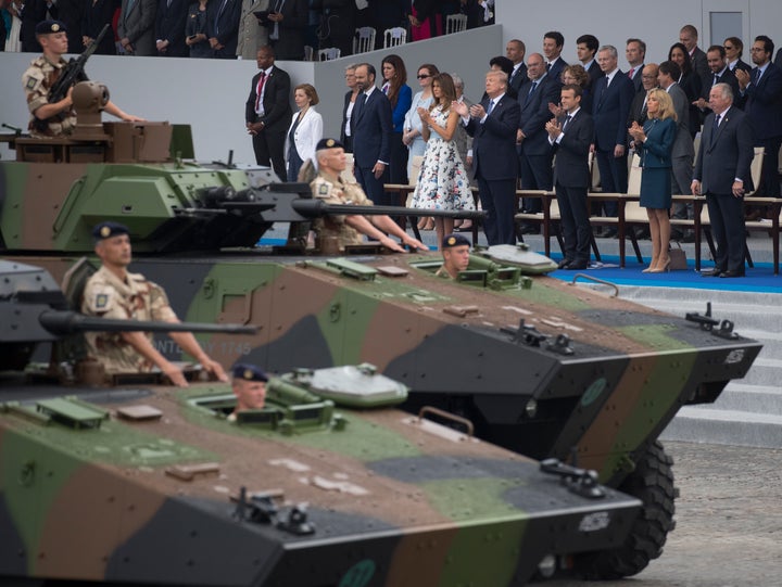 Tanks parade past President Donald Trump, first lady Melania Trump, French President Emmanuel Macron and his wife Brigitte Macron, during Bastille Day parade on the Champs Elysees avenue in Paris, Friday, July 14, 2017. (AP Photo/Carolyn Kaster)