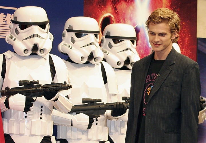 Hayden Christensen stands in front of stormtroopers during a photocall to promote the film "Star Wars: Episode III - Revenge Of The Sith."