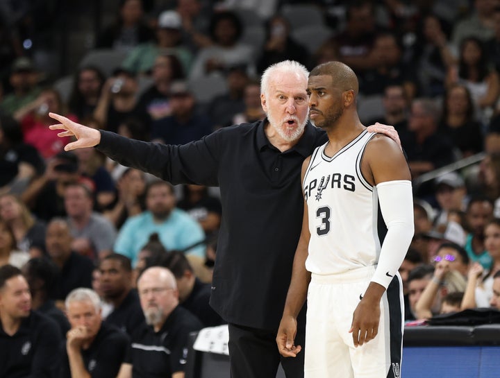 Head coach Gregg Popovich of the San Antonio Spurs talks with Chris Paul #3 during action against the Orlando Magic in the second half of a preseason game at Frost Bank Center on October 9, 2024 in San Antonio, Texas. (Photo by Ronald Cortes/Getty Images)