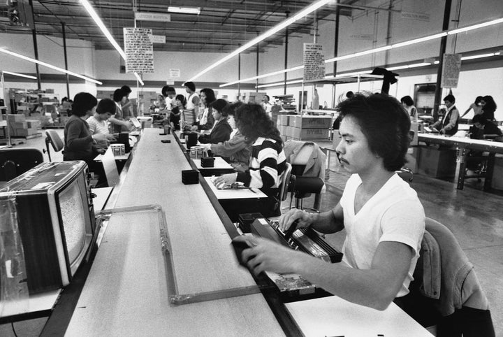 The Trump Administration Thinks You Ought to Be OK With Being Poor 1 Workers assemble computer chips along a conveyor belt in a Silicon Valley factory.