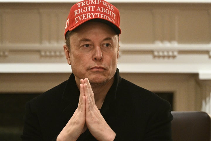 Elon Musk is seen wearing a hat reading "Trump was right about everything" during a Cabinet meeting with the president at the White House in March.