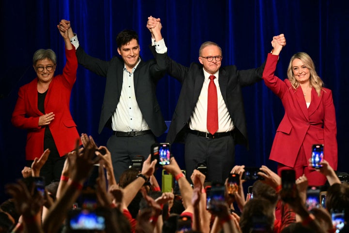 Australia's Prime Minister Anthony Albanese celebrates with his partner Jodie Haydon (R), son Nathan and Australia's Foreign Minister Penny Wong (L) after winning the general election at the Labor Party election night event in Sydney on May 3, 2025. (Photo by SAEED KHAN/AFP via Getty Images)
