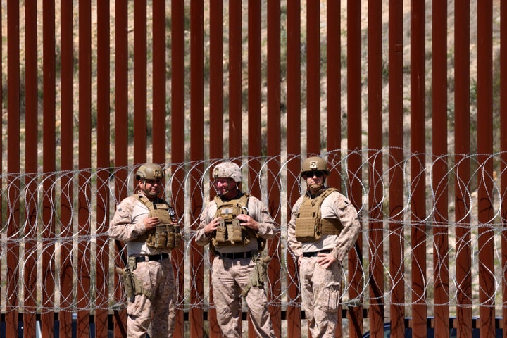 Members of the U.S. military stand in front of the border wall along the U.S. and Mexico border near San Ysidro on March 21, 2025. (Photo by Genaro Molina/Los Angeles Times via Getty Images)